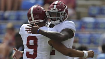 Sep 18, 2021; Gainesville, Florida, USA; Alabama Crimson Tide quarterbacks Bryce Young (9) and Jalen Milroe (2) embrace during warm ups before the game against the Florida Gators at Ben Hill Griffin Stadium. Mandatory Credit: Gary Cosby-Imagn Images