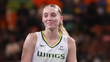 Aug 29, 2025; College Park, Georgia, USA; Atlanta Dream guard Rhyne Howard (10) talks to Dallas Wings guard Paige Bueckers (5) in the second quarter at Gateway Center Arena at College Park. Mandatory Credit: Brett Davis-Imagn Images
