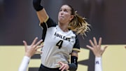 Purdue Junior Kenna Wollard (4) floats the ball over blockers