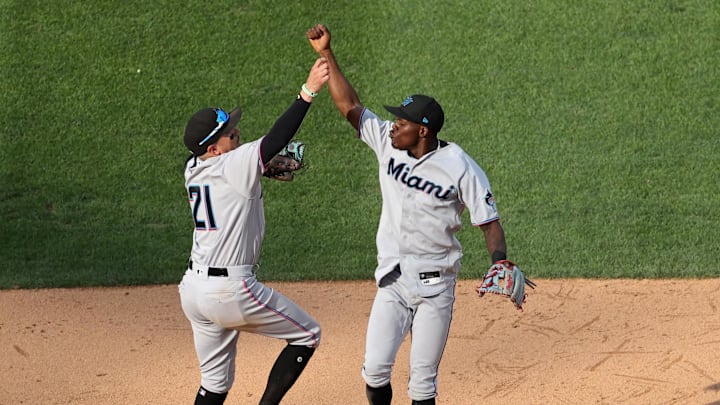 Miguel Rojas (left) and Jazz Chisholm Jr. (right) celebrate after a 2021 win.