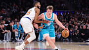 Dec 3, 2025; New York, New York, USA;  Charlotte Hornets guard Kon Knueppel (7) drives past New York Knicks guard Mikal Bridges (25) in the second quarter at Madison Square Garden. Mandatory Credit: Wendell Cruz-Imagn Images