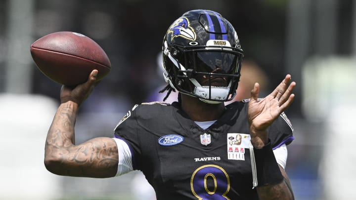 Jul 27, 2024; Owings Mill , MD, USA; Ravens quarterback Lamar Jackson (8) throws during the afternoon session of training camp at the Under Armour Performance Center.