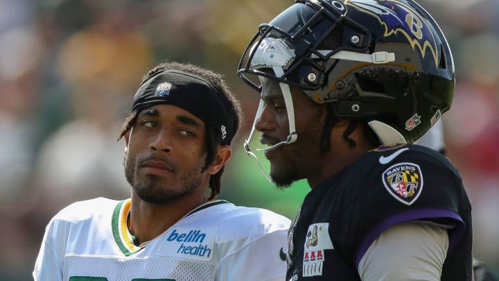 Green Bay Packers cornerback Jaire Alexander talks with Baltimore Ravens quarterback and former University of Louisville teammate Lamar Jackson during a joint practice on Thursday, August 22, 2024, at Ray Nitschke Field in Ashwaubenon, Wis.