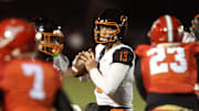 Cocoa quarterback Champ Smith (13) looks to pass against Bradford during the second half of the Class 2A regional finals on Nov. 28. Cocoa won 17-10 with a touchdown in the final minute. The Tigers travel to play Sarasota Cardinal Mooney in the state semifinals on Friday, Dec. 5.