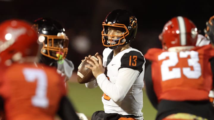 Cocoa quarterback Champ Smith (13) looks to pass against Bradford during the second half of the Class 2A regional finals on Nov. 28. Cocoa won 17-10 with a touchdown in the final minute. The Tigers travel to play Sarasota Cardinal Mooney in the state semifinals on Friday, Dec. 5.