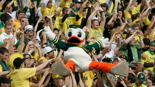 Fans carry the Oregon Duck over their heads during a game at Autzen Stadium