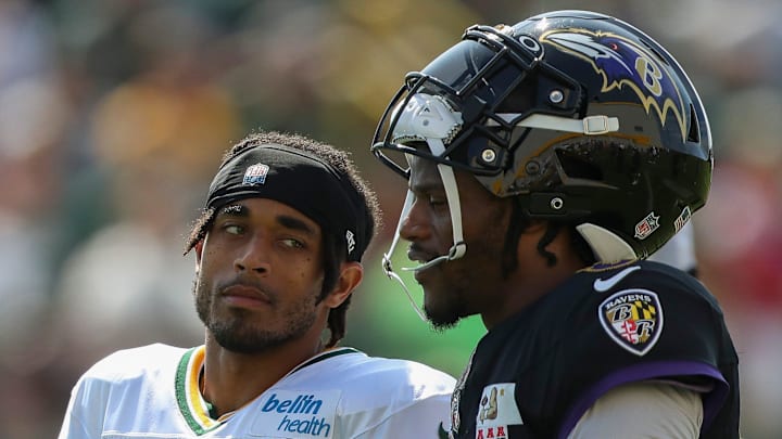 Green Bay Packers cornerback talks with Baltimore Ravens quarterback and former University of Louisville teammate Lamar Jackson (8) during a joint practice on Thursday, August 22, 2024, at Ray Nitschke Field in Ashwaubenon, Wis. 
Tork Mason/USA TODAY NETWORK-Wisconsin