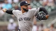 Jul 20, 2025; Cumberland, Georgia, USA; New York Yankees relief pitcher Devin Williams (38) pitches against the Atlanta Braves during the ninth inning at Truist Park. Mandatory Credit: Dale Zanine-Imagn Images