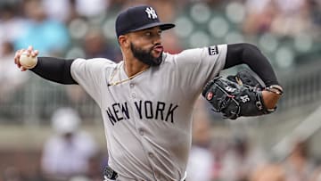 Jul 20, 2025; Cumberland, Georgia, USA; New York Yankees relief pitcher Devin Williams (38) pitches against the Atlanta Braves during the ninth inning at Truist Park. Mandatory Credit: Dale Zanine-Imagn Images