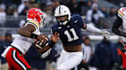 Nov 30, 2024; University Park, Pennsylvania, USA; (Editors Notes: Caption Correction) Penn State Nittany Lions defensive end Abdul Carter (11) pressures Maryland Terrapins quarterback MJ Morris (7) during the first quarter at Beaver Stadium. Mandatory Credit: Matthew O'Haren-Imagn Images