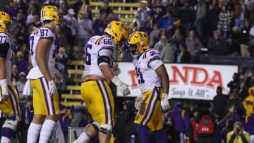 Nov 19, 2022; Baton Rouge, Louisiana, USA;  LSU Tigers running back Noah Cain (21) and offensive lineman Will Campbell (66) celebrate scoring a touchdown against the UAB Blazers the first half at Tiger Stadium. Mandatory Credit: Stephen Lew-USA TODAY Sports