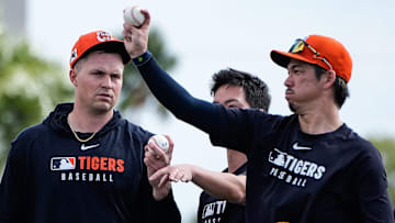 Detroit Tigers pitcher Kenta Maeda, right, demonstrates a pitch to pitcher Tarik Skubal, left, during spring training at TigerTown in Lakeland, Fla. on Sunday, Feb. 16, 2025.