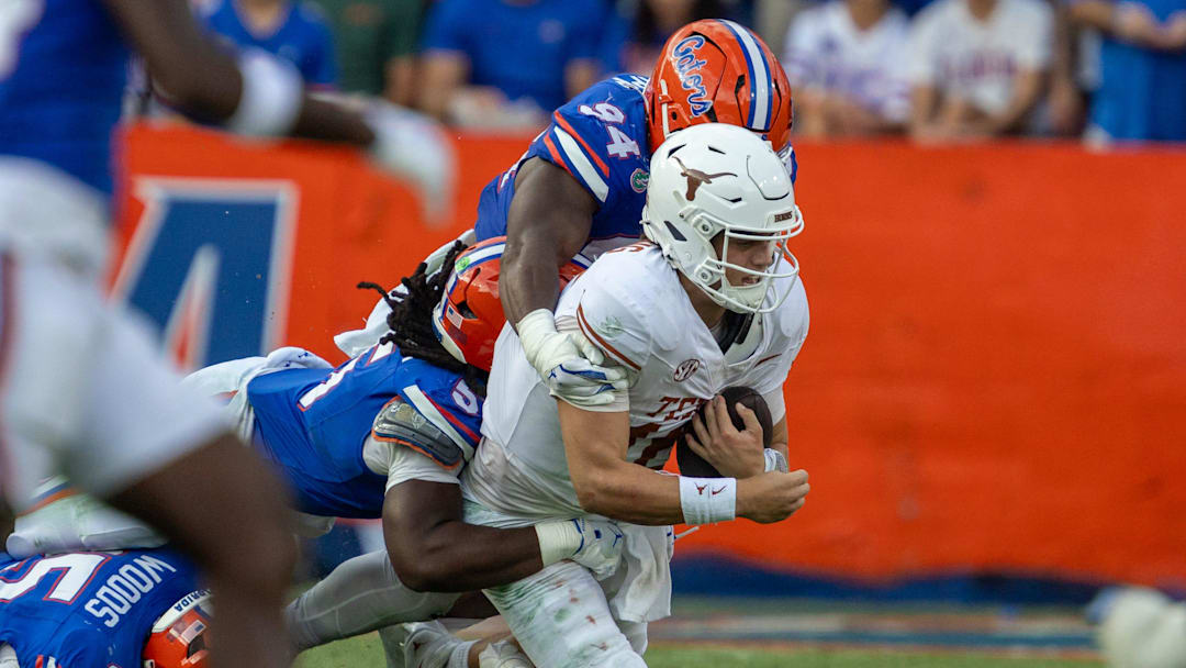 Florida Jamari Lyons takes down Texas quarterback Arch Manning (16) during the second half an NCAA football game in Gainesville, FL on Saturday, October 4, 2025. [Alan Youngblood/Gainesville Sun]