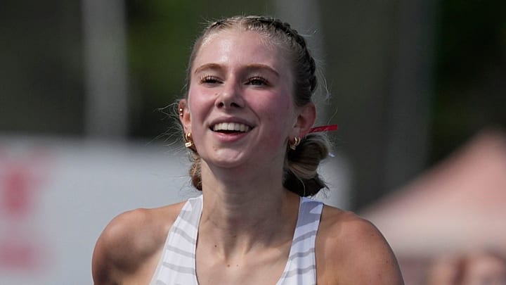 DCG’s Piper Messerly celebrates as finishing her 4A girls 3000-meter run in the Iowa High School co-ed state Track and field at Drake Stadium on May 22, 2025, in Des Moines, Iowa.
