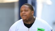 Jul 26, 2023; Foxborough, MA, USA; New England Patriots offensive tackle Trent Brown (77) makes his way to the practice fields for  training camp at Gillette Stadium. Mandatory Credit: Eric Canha-USA TODAY Sports