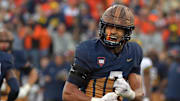 Oct 19, 2024; Champaign, Illinois, USA;  Illinois Fighting Illini defensive back Matthew Bailey (7) reacts after a turnover against the Michigan Wolverines during the second half at Memorial Stadium.