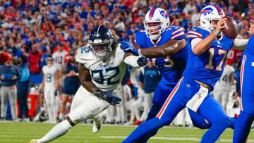 Tennessee Titans linebacker Ola Adeniyi (92) rushes Buffalo Bills quarterback Josh Allen (17) with Buffalo Bills offensive tackle David Quessenberry (77) blocking during the first half at Highmark Stadium. 