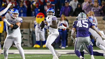 Oct 26, 2024; Manhattan, Kansas, USA; Kansas Jayhawks quarterback Jalon Daniels (6) drops back to pass during the fourth quarter against the Kansas State Wildcats at Bill Snyder Family Football Stadium. Mandatory Credit: Scott Sewell-Imagn Images