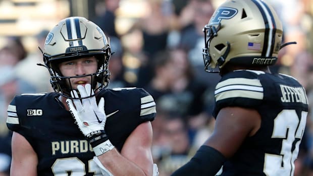 Purdue Boilermakers defensive back Dillon Thieneman (31) talks to Purdue Boilermakers defensive back Joseph Jefferson II (32)