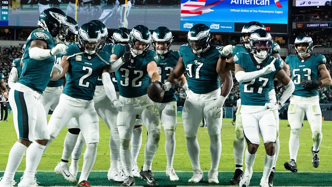 Nov 14, 2024; Philadelphia, Pennsylvania, USA; Philadelphia Eagles safety Reed Blankenship (32) celebrates with teammates after his interception during the fourth quarter against the Washington Commanders at Lincoln Financial Field. Mandatory Credit: Bill Streicher-Imagn Images