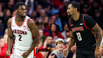 Nov 24, 2025; Tucson, Arizona, USA; Arizona Wildcats guard Dwayne Aristode (2) winks at Denver Pioneers guard Julius Rollins (8) after he makes a three pointer during the first half of the game at McKale Memorial Center. Mandatory Credit: Aryanna Frank-Imagn Images