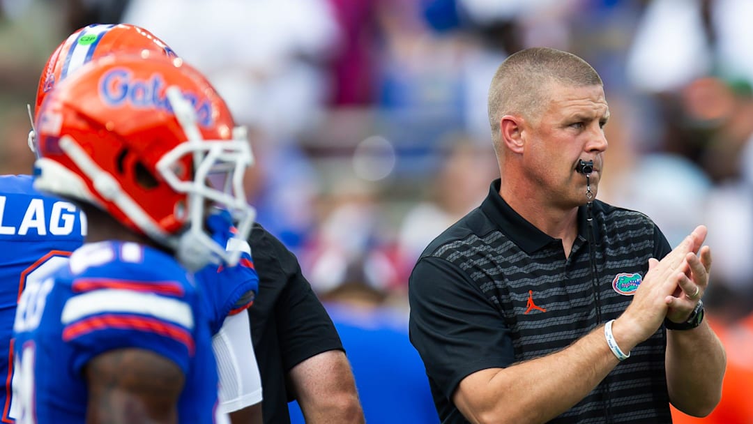 Florida Gators head coach Billy Napier warm up his players during the season opener at Ben Hill Griffin Stadium in Gainesville, FL on Saturday, August 31, 2024 against the University of Miami Hurricanes in the first half. [Doug Engle/Gainesville Sun]