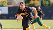 Granada High school senior Delaney Aumua charges in on a San Ramon Valley bunt attempt during a recent EBAL game. Aumua, a Auburn signee, just broke the North Coast Section record for most career home runs with 43.
