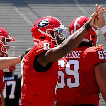 Georgia wide receiver Colbie Young (8) coal celebrates with Georgia quarterback Carson Beck (15) after scoring a touchdown during the G-Day spring football game in Athens, Ga., on Saturday, April 13, 2024.