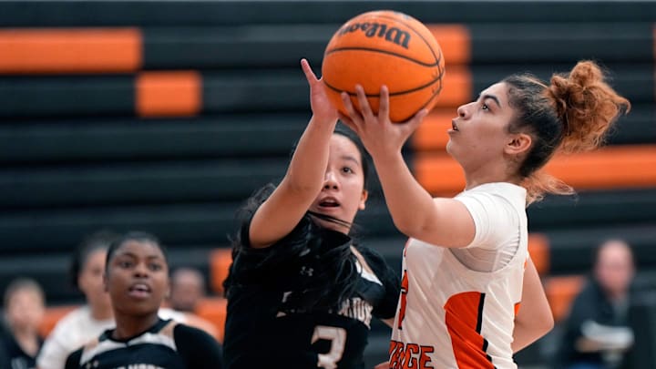 Spruce Creek's Lillian Sanchez drives to the basket during a game against visiting Bishop Moore on Jan. 11, 2024. Last week, the sophomore scored 14 of her 22 points in the fourth quarter to lift the Hawks past DeLand, 60-41, in the Class 7A, District 2 championship game. Spruce Creek's Lillian Sanchez drives to the basket during a game against visiting Bishop Moore on Jan. 11, 2024. Last week, the sophomore scored 14 of her 22 points in the fourth quarter to lift the Hawks past DeLand, 60-41, in the Class 7A, District 2 championship game.