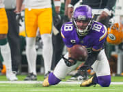 Dec 31, 2023; Minneapolis, Minnesota, USA; Minnesota Vikings wide receiver Justin Jefferson (18) catches a pass against the Green Bay Packers in the second quarter at U.S. Bank Stadium. Mandatory Credit: Brad Rempel-USA TODAY Sports