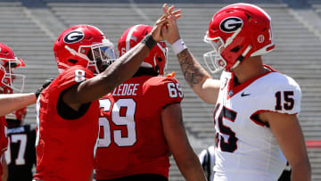 Georgia wide receiver Colbie Young (8) coal celebrates with Georgia quarterback Carson Beck (15)
