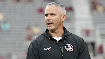 Urban Meyer is one analyst who thinks Florida State's reported contracts with players could seriously damage the school.