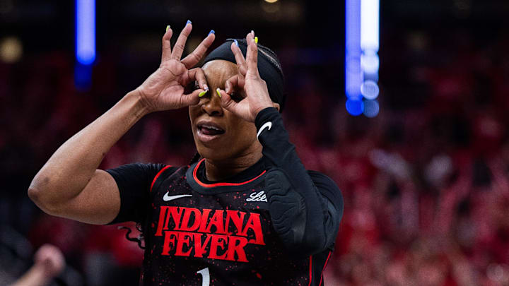 Sep 28, 2025; Indianapolis, Indiana, USA; Indiana Fever guard Odyssey Sims (1) celebrates a made shot in the first half during game four against the Las Vegas Aces of the second round for the 2025 WNBA Playoffs at Gainbridge Fieldhouse. Mandatory Credit: Trevor Ruszkowski-Imagn Images