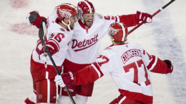 Mar 1, 2025; Columbus, Ohio, USA;  Detroit Red Wings right wing Alex DeBrincat (93) celebrates with teammates after scoring a goal against the Columbus Blue Jackets in the third period at Ohio Stadium. Mandatory Credit: Aaron Doster-Imagn Images