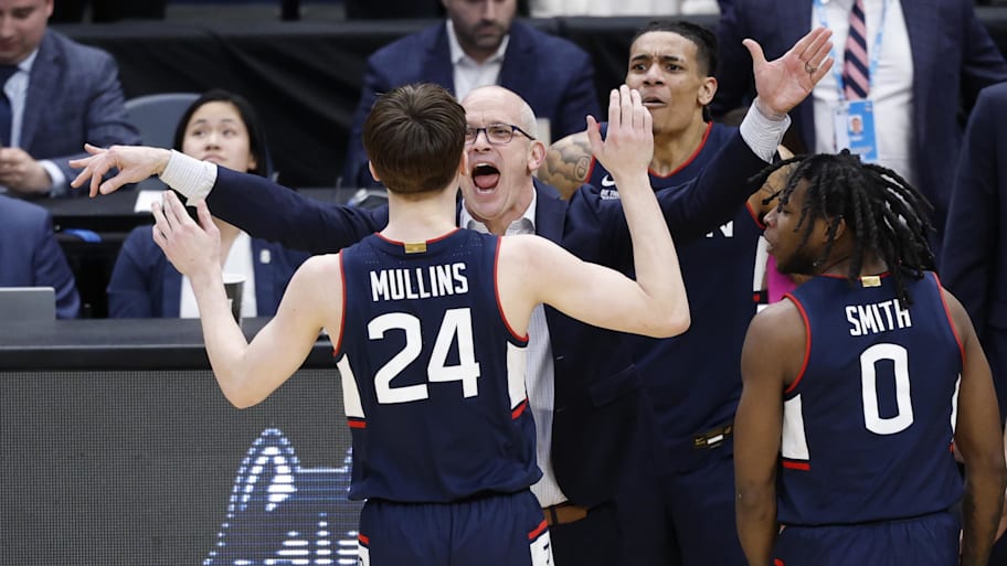Dan Hurley congratulates Braylon Mullins after he made the game-winning three-pointer against Duke in the Elite Eight.