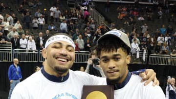 Penn State wrestlers Aaron Brooks (left) and Carter Starocci celebrate their national championships at the 2024 NCAA Wrestling Championships in Kansas City. 