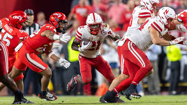 Nebraska running back Emmett Johnson rushes for a short gain against Cincinnati in Kansas City.