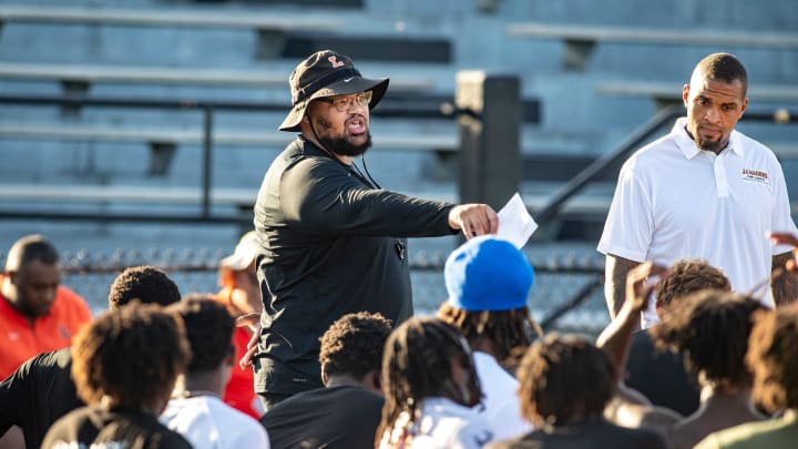 Lakeland Football Coach Marvin Frazier , left and Mike Pouncey talk with Lakeland High School football players during their first day of practice at Bryant Stadium in Lakeland Fl. Monday July 29 2024.
Ernst Peters/The Ledger