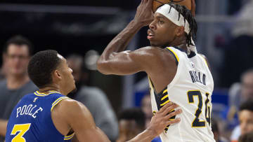 Dec 5, 2022; San Francisco, California, USA; Indiana Pacers guard Buddy Hield (24) looks to pass around Golden State Warriors guard Jordan Poole (3) during the third quarter at Chase Center. Mandatory Credit: D. Ross Cameron-USA TODAY Sports