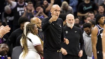 Apr 13, 2025; Sacramento, California, USA;  Sacramento Kings interim head coach Doug Christie gestures to the Phoenix Suns bench after the game at Golden 1 Center. Mandatory Credit: John Hefti-Imagn Images