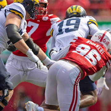 Nebraska defensive lineman Williams Nwaneri pursues Michigan's Bryce Underwood.