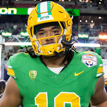 Jan 1, 2024; Glendale, AZ, USA; Oregon Ducks defensive end Matayo Uiagalelei (10) against the Liberty Flames during the 2024 Fiesta Bowl at State Farm Stadium. Mandatory Credit: Mark J. Rebilas-Imagn Images