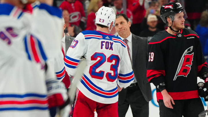 May 16, 2024; Raleigh, North Carolina, USA; Carolina Hurricanes head coach Rod Brind’Amour shake hands with New York Rangers defenseman Adam Fox (23) after the Rangers win in game six of the second round of the 2024 Stanley Cup Playoffs at PNC Arena. Mandatory Credit: James Guillory-USA TODAY Sports