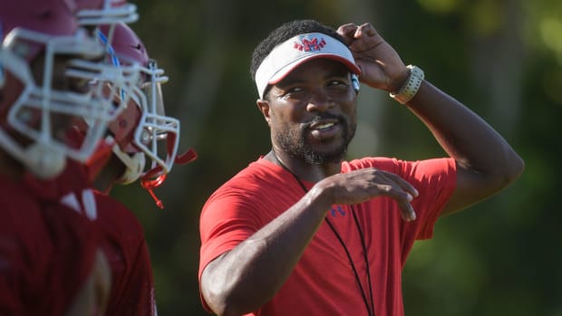 Manatee High School offensive coordinator Jacquez Green oversees practice on Wednesday. 