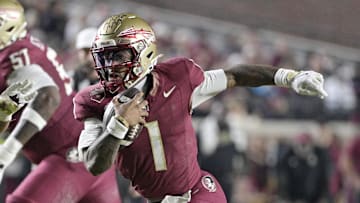 Nov 15, 2025; Tallahassee, Florida, USA; Florida State Seminoles quarterback Thomas Castellanos (1) runs the ball past Virginia Tech Hokies defensive lineman Kelvin Gilliam Jr. (22) during the first half at Doak S. Campbell Stadium. Mandatory Credit: Melina Myers-Imagn Images