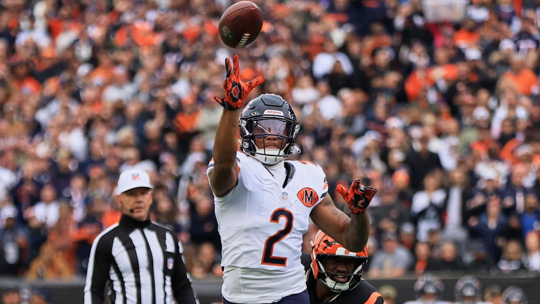 Nov 2, 2025; Cincinnati, Ohio, USA; Chicago Bears wide receiver DJ Moore (2) throws a 2-yard touchdown pass to quarterback Caleb Williams (not pictured) during the first quarter against the Cincinnati Bengals