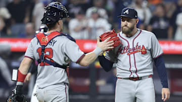Jun 23, 2025; New York City, New York, USA;  Atlanta Braves catcher Sean Murphy (12) and relief pitcher Dylan Lee (52) congratulate each other after defeating the New York Mets 3-2 at Citi Field. Mandatory Credit: Wendell Cruz-Imagn Images
