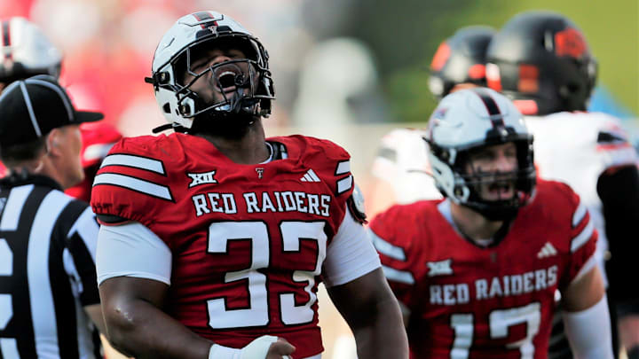 Texas Tech defensive lineman A.J. Holmes Jr. reacts after a tackle against Oklahoma State.