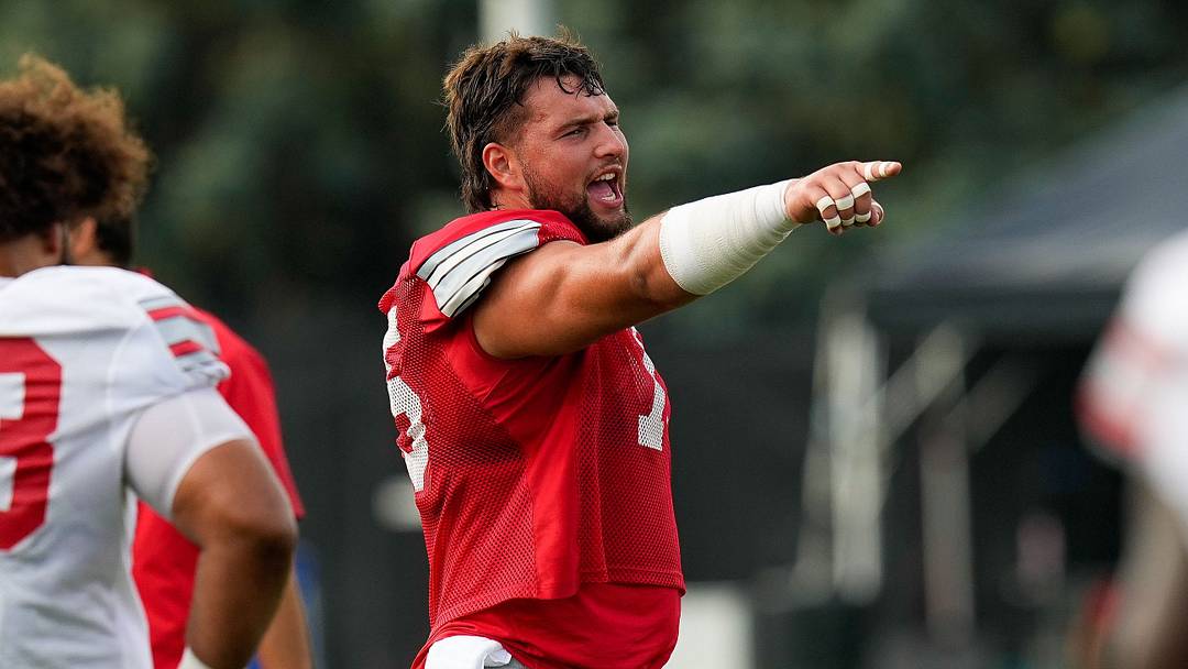 Ohio State Buckeyes offensive lineman Carson Hinzman (75) points at a teammate during the third day of training camp at the Woody Hayes Athletic Center on Aug. 8, 2026 in Columbus, Ohio.