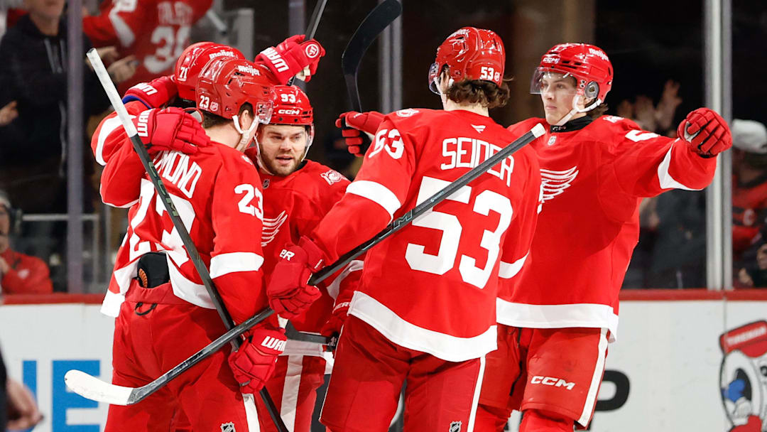 Mar 24, 2026; Detroit, Michigan, USA;  Detroit Red Wings center Dylan Larkin (71) receives congratulations from teammates after scoring in the third period against the Ottawa Senators at Little Caesars Arena. Mandatory Credit: Rick Osentoski-Imagn Images